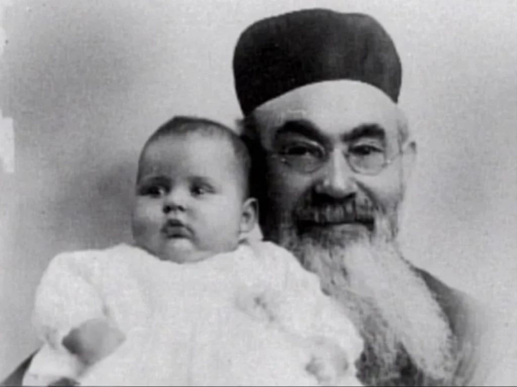 Rabbi Paltrovich holding a child